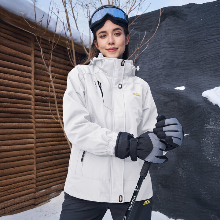 Female model walking in a park, wearing a Verona 3-in-1 black waterproof jacket, comfortable & chic.