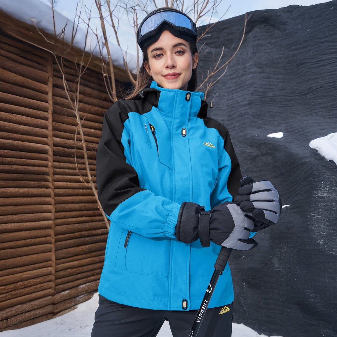 Model in an urban setting, wearing a black Verona 3-in-1 waterproof jacket, blending style & utility.