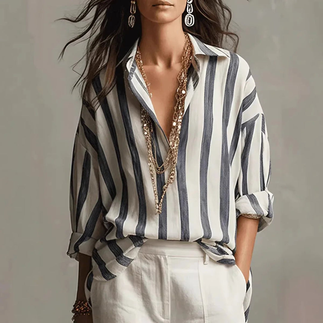 Women's vertical stripe blouse with an open collar & long sleeves. Stylish, versatile top for office or casual wear.