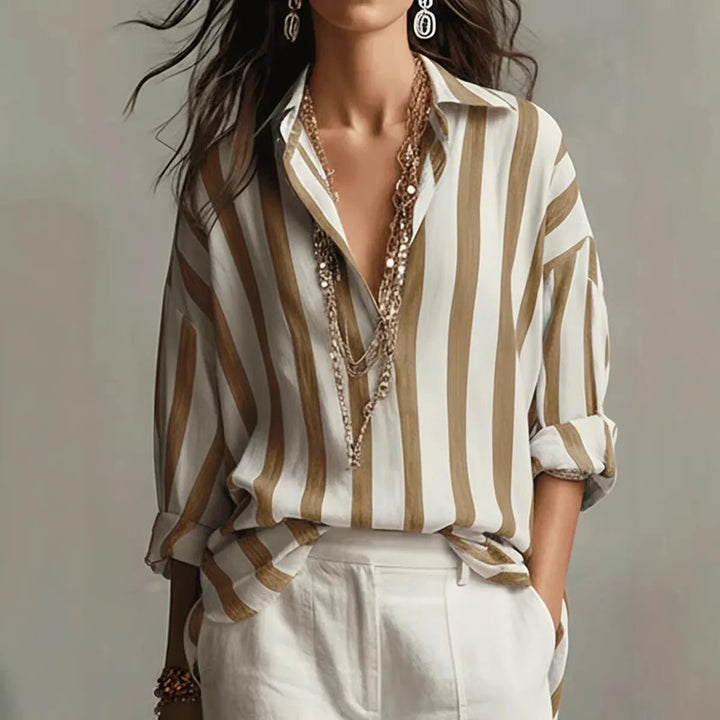 Elegant women's long sleeve blouse in a vertical stripe pattern. Comfortable open collar top for business casual fashion.