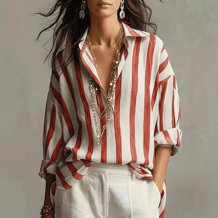 Stylish fall/spring women's vertical stripe blouse. Open collar, long sleeve top for a chic, comfortable look.