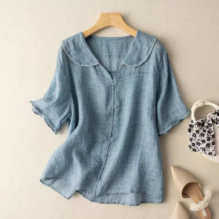 Elegant women's vintage style blouse featuring a scalloped collar and relaxed fit for timeless fashion.