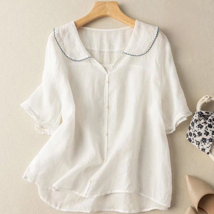 Stylish women's vintage button-up blouse with unique scalloped collar, relaxed fit for effortless appeal.