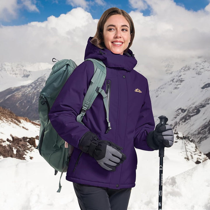 Women's ski jacket laid flat, showcasing full design and features for winter outdoor wear