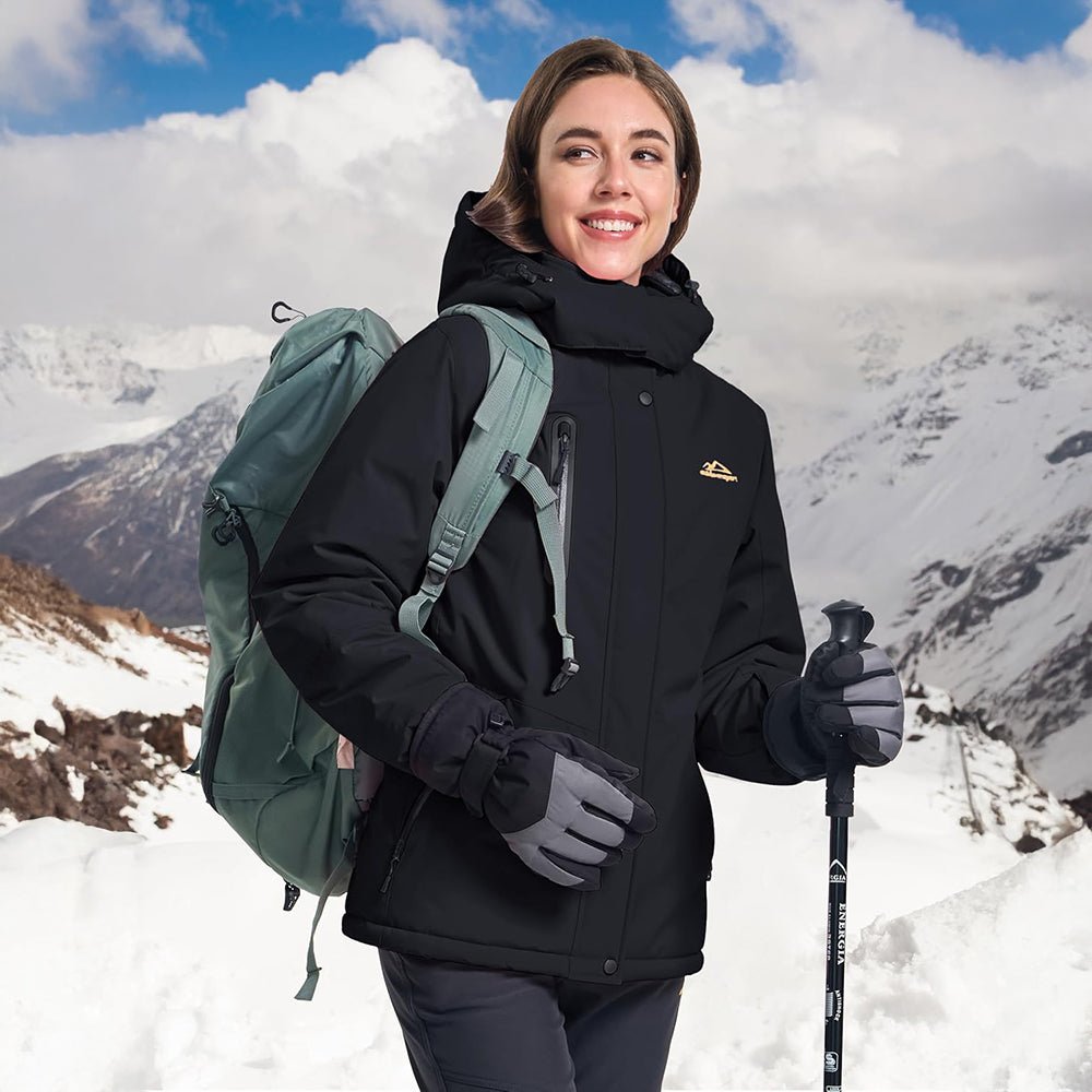 Model wearing women's waterproof ski jacket with fleece lining, active pose on ski slopes