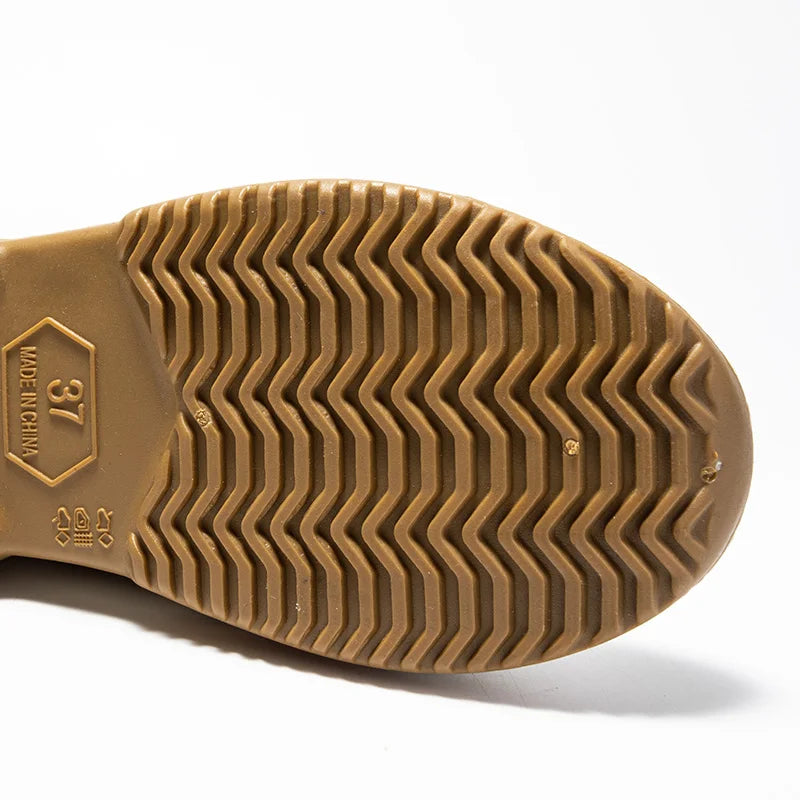 Practical women's slip-on waterproof rain ankle boots, ideal for navigating puddles with ease.
