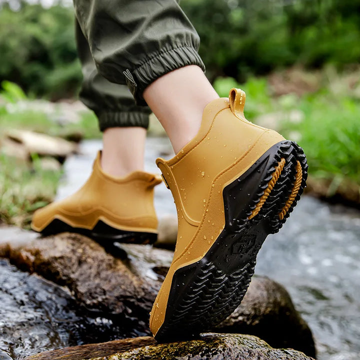 Chic white women's waterproof slip-on ankle rain boots, fashionable and functional for wet weather.