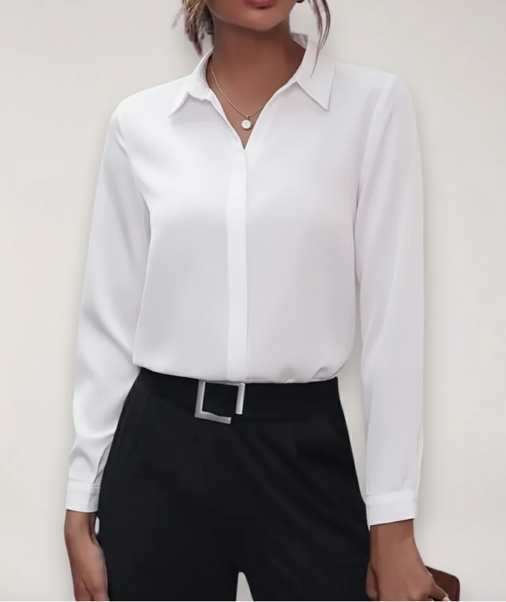Women's white buttoned office blouse with long sleeves, perfect for spring professional attire.