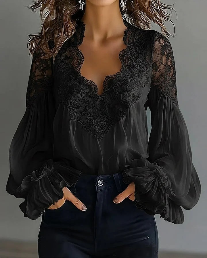 Elegant white lace top with delicate V-neck and dramatic puff ruffle sleeves, ideal for romantic fashion.