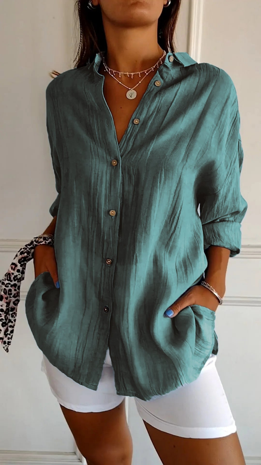 Versatile women's oversized button-down top. Collared, long sleeve, relaxed fit for effortless casual and summer fashion.