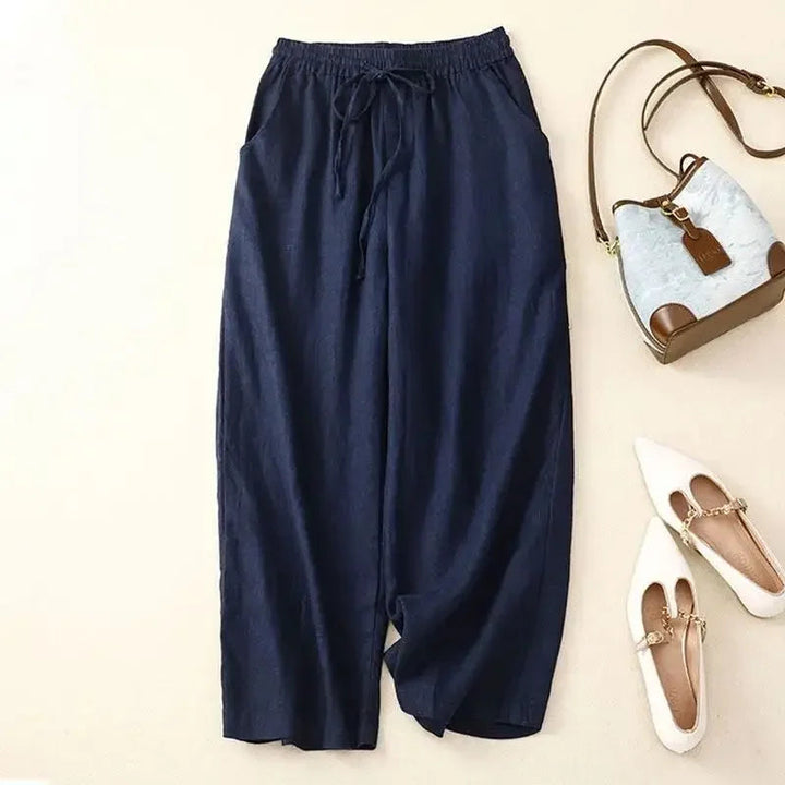 Stylish woman wearing comfortable wide-leg linen blend pants, perfect for a relaxed summer fashion look