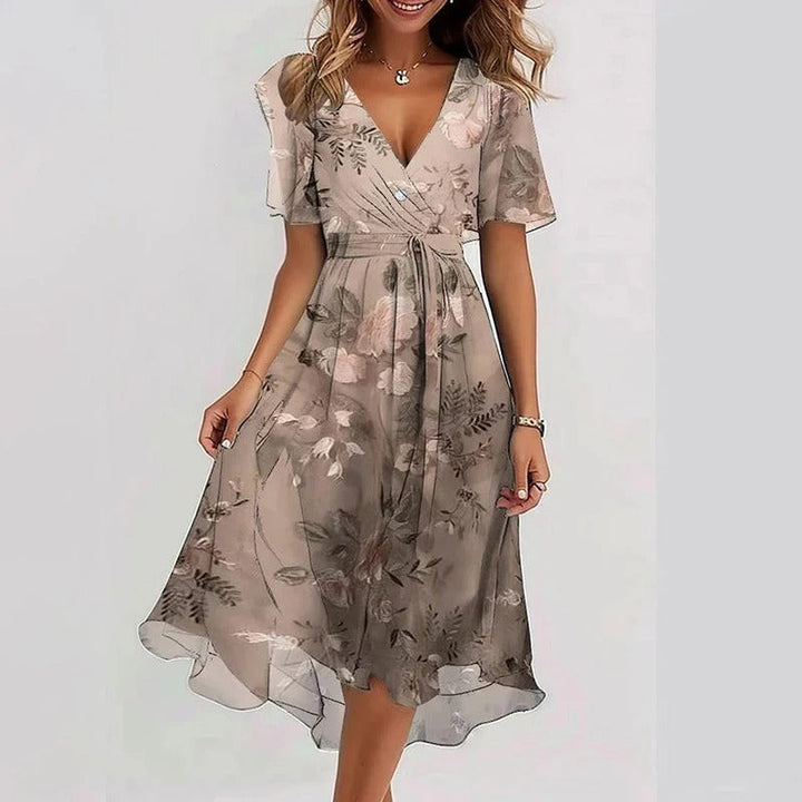 Chic women's wrap V-neck midi dress with delicate flutter sleeves & a sophisticated ruffle hem design.