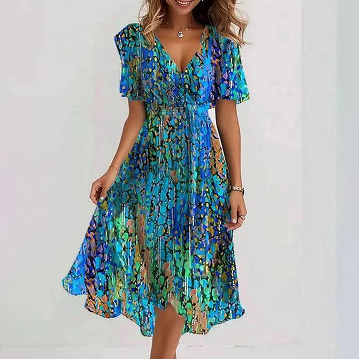 Flowing women's wrap V-neck midi dress with feminine flutter sleeves, great for summer events.
