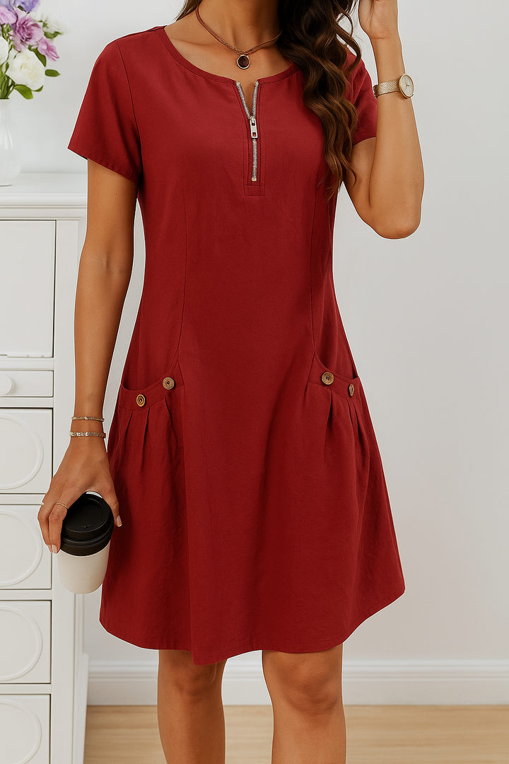 Women's short sleeve midi dress. Casual zip front design with pockets. Comfortable, versatile everyday summer dress.