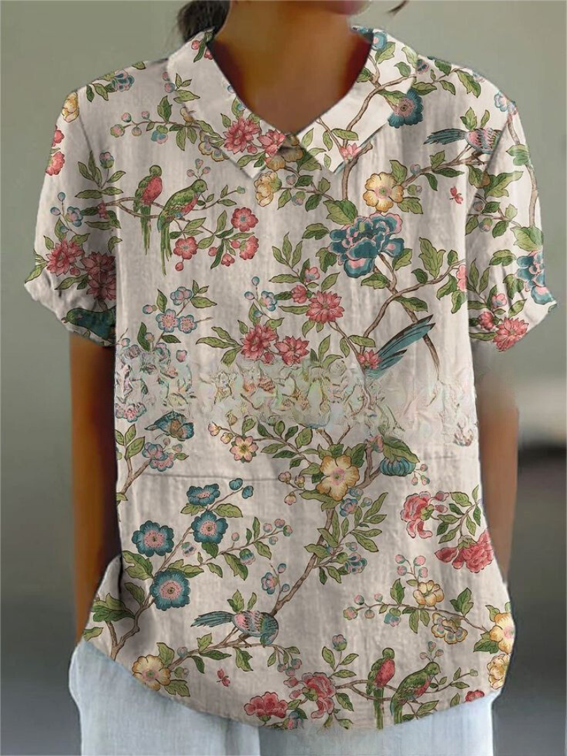 Women's blouse with short gathered sleeves, pointed collar, relaxed fit, perfect for spring-summer style and comfort.