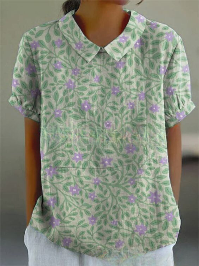Women's blouse with short gathered sleeves, pointed collar, relaxed fit, perfect for spring-summer style and comfort.