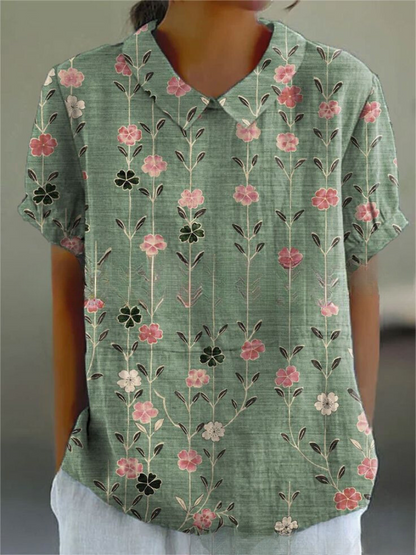 Women's blouse with short gathered sleeves, pointed collar, relaxed fit, perfect for spring-summer style and comfort.