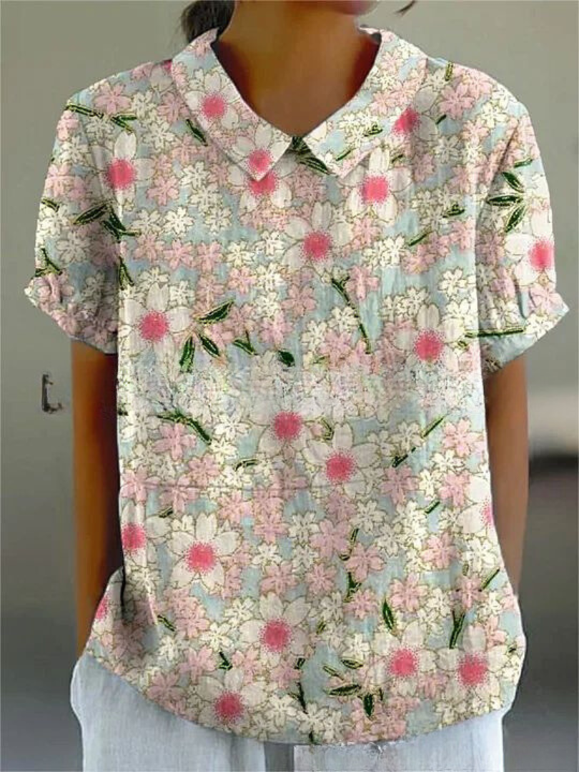 Women's blouse with short gathered sleeves, pointed collar, relaxed fit, perfect for spring-summer style and comfort.