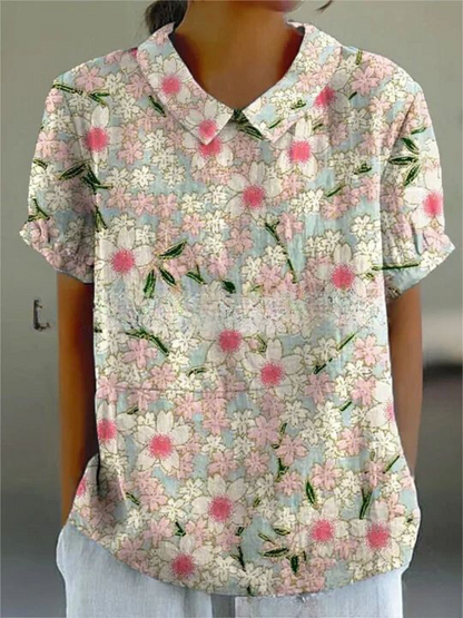 Women's blouse with short gathered sleeves, pointed collar, relaxed fit, perfect for spring-summer style and comfort.
