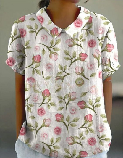 Women's blouse with short gathered sleeves, pointed collar, relaxed fit, perfect for spring-summer style and comfort.