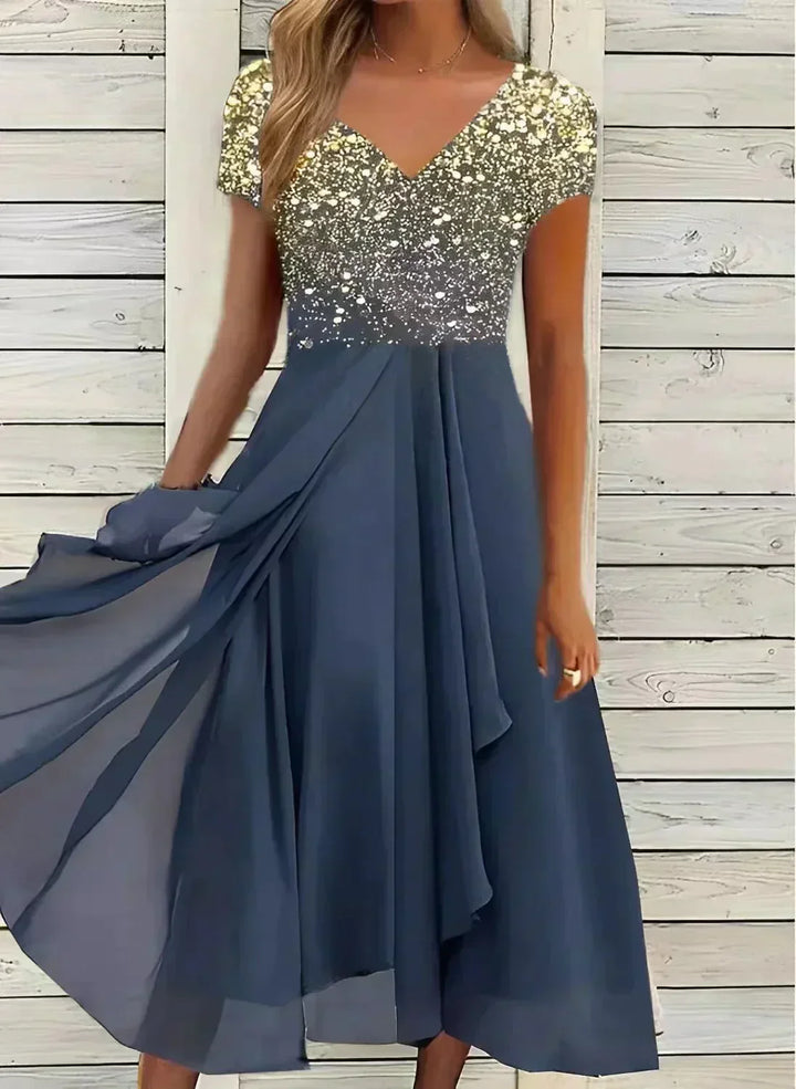 "Women's chiffon evening maxi dress with floral bodice, featuring flowing fabric and shimmering floral design for elegant eve
