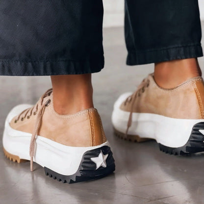 Women's chunky platform sneakers with a bold sole, rounded toe, and trendy contrast details for stylish all-day comfort.