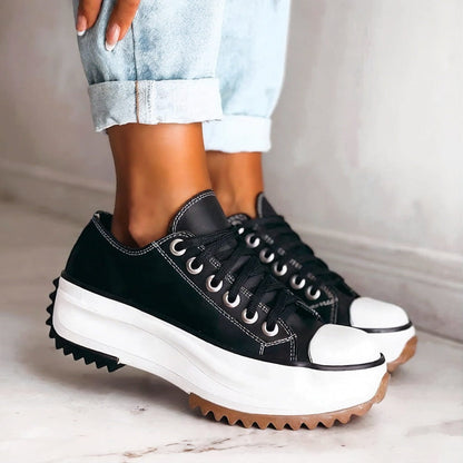 Women's chunky platform sneakers with a bold sole, rounded toe, and trendy contrast details for stylish all-day comfort.