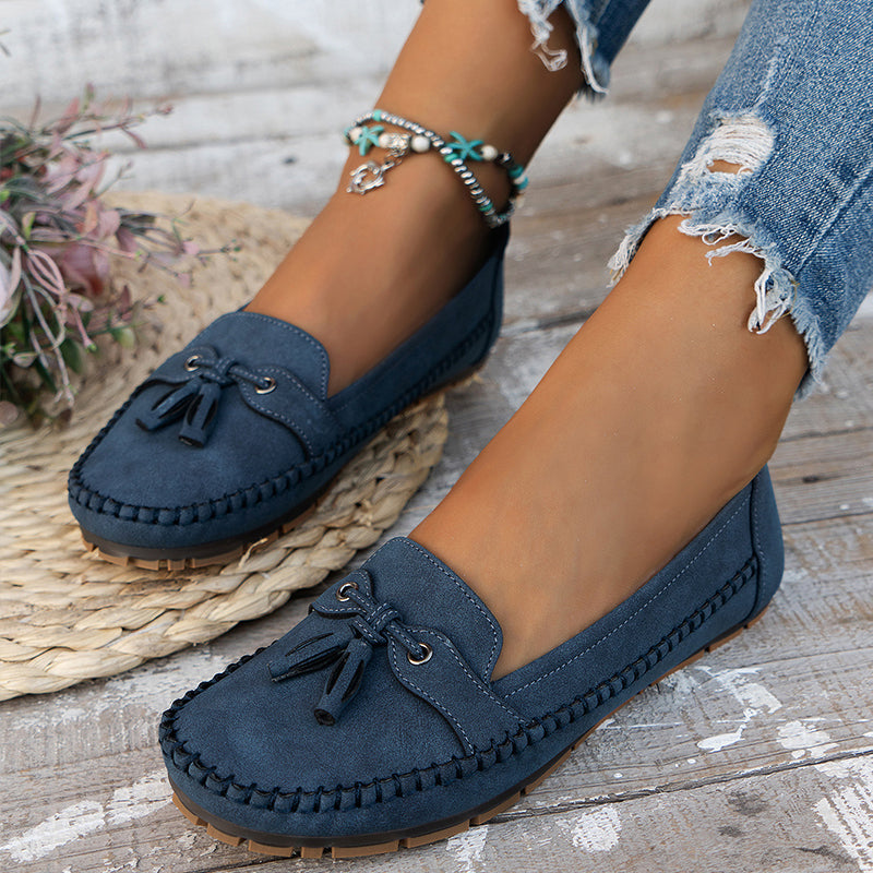 "Women's classic bow loafers in soft suede, stylish flat slip-ons with elegant bow accent, ideal for any occasion."