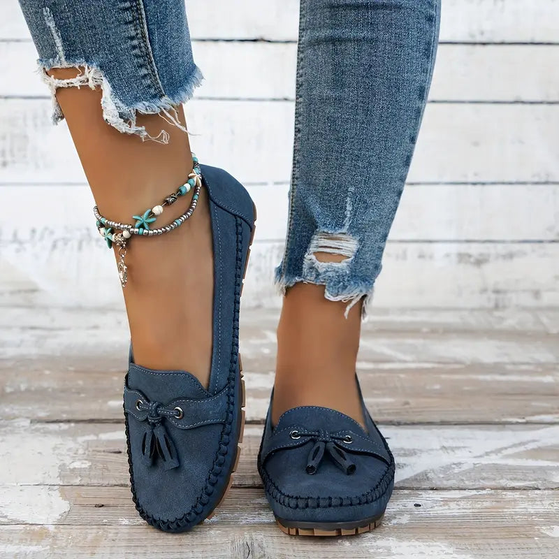 "Women's classic bow loafers in soft suede, stylish flat slip-ons with elegant bow accent, ideal for any occasion."