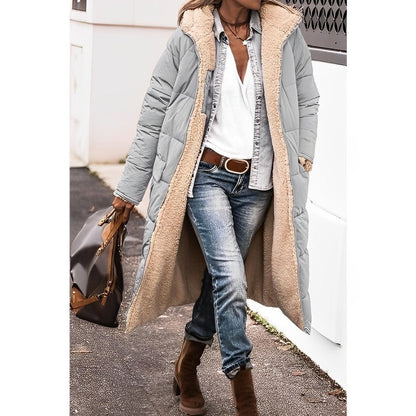 "Women's hooded longline quilted winter coat, front view; insulated, open front design with quilted texture and hood."