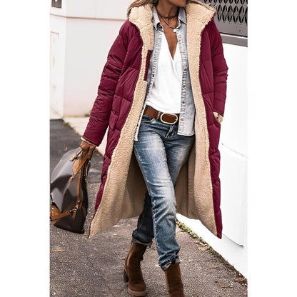 "Women's hooded longline quilted winter coat, front view; insulated, open front design with quilted texture and hood."