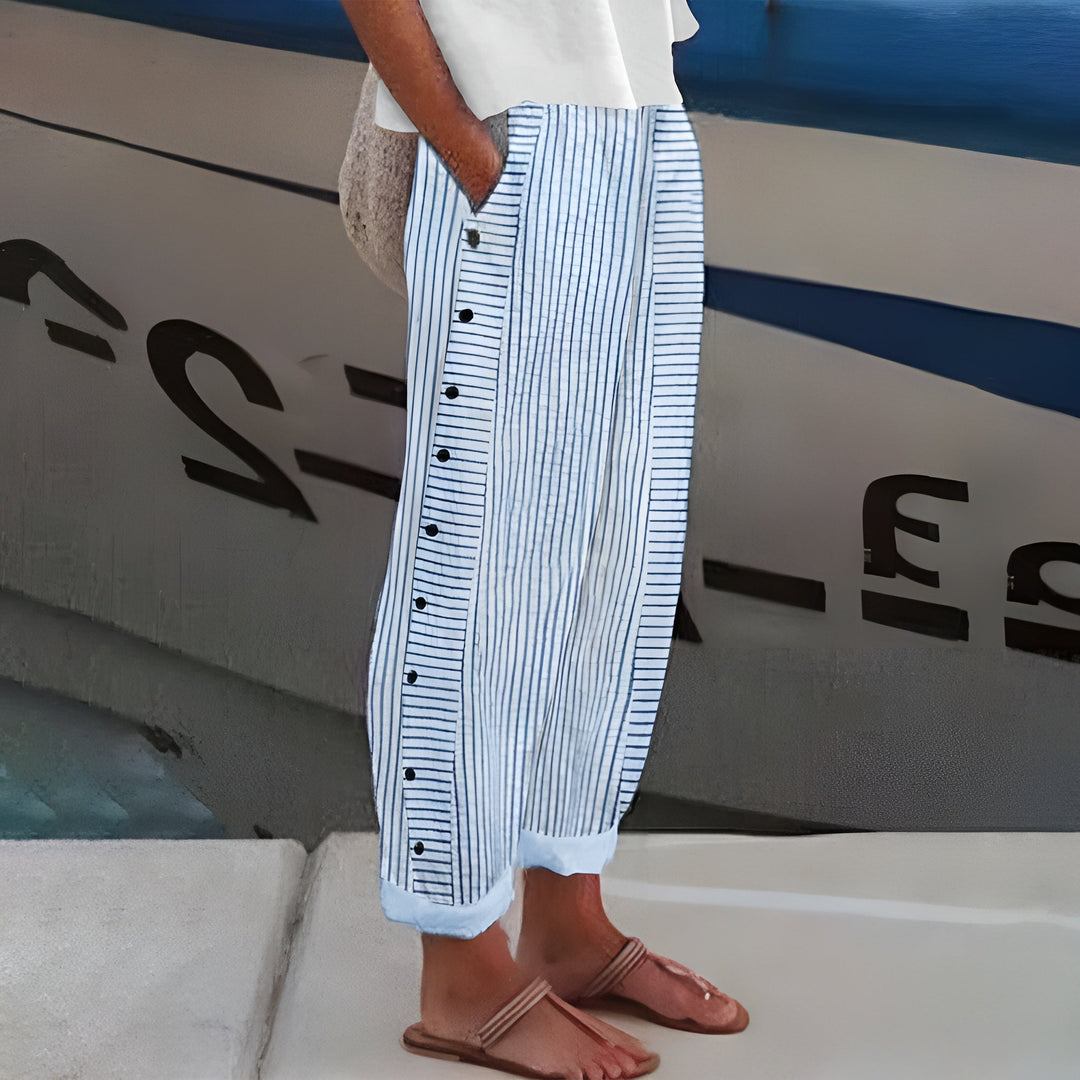 Women's linen blend striped pants, front view; drawstring waist, vertical stripes, ankle-length, side pockets, loose fit.