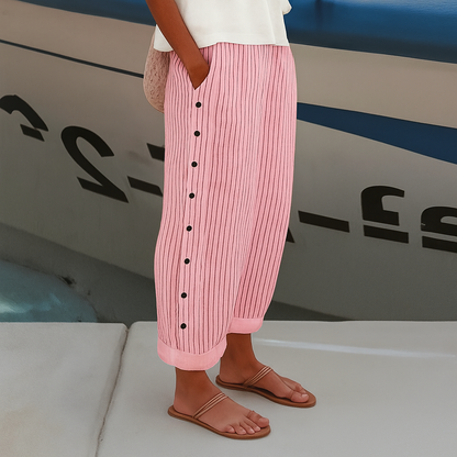 Women's linen blend striped pants, front view; drawstring waist, vertical stripes, ankle-length, side pockets, loose fit.