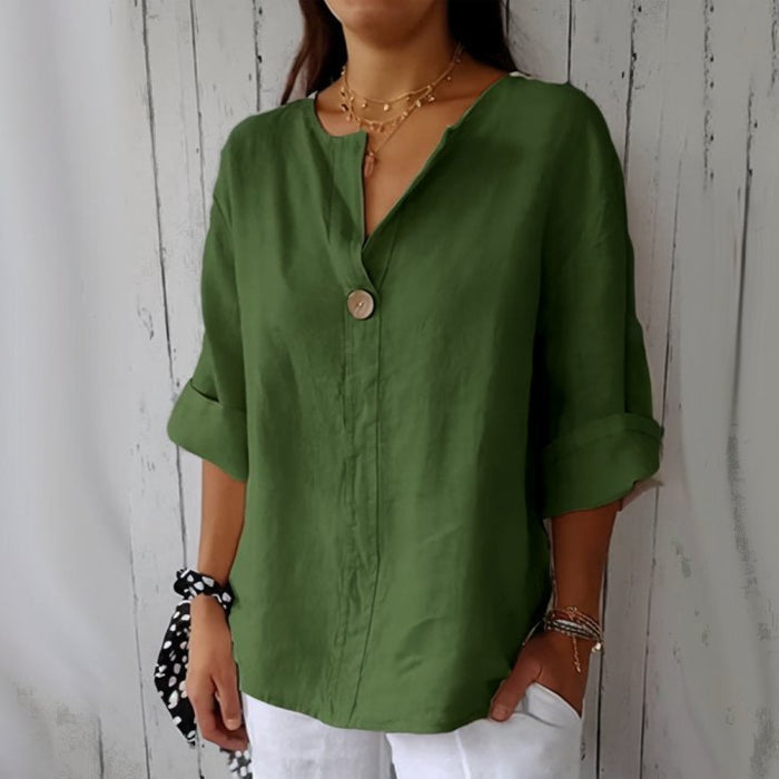 "Women's linen V-neck blouse with rolled sleeves, featuring a relaxed fit and soft breathable fabric."