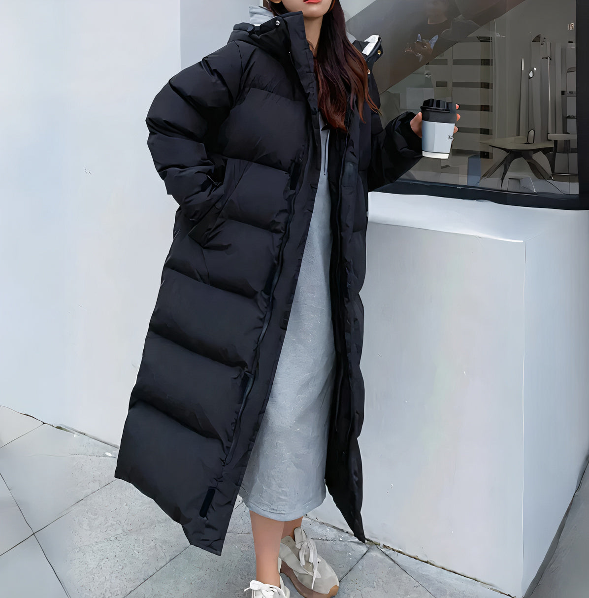 "Women's long puffer jacket, hooded winter coat, front view; insulated, water-resistant, sleek fit for warmth and style."