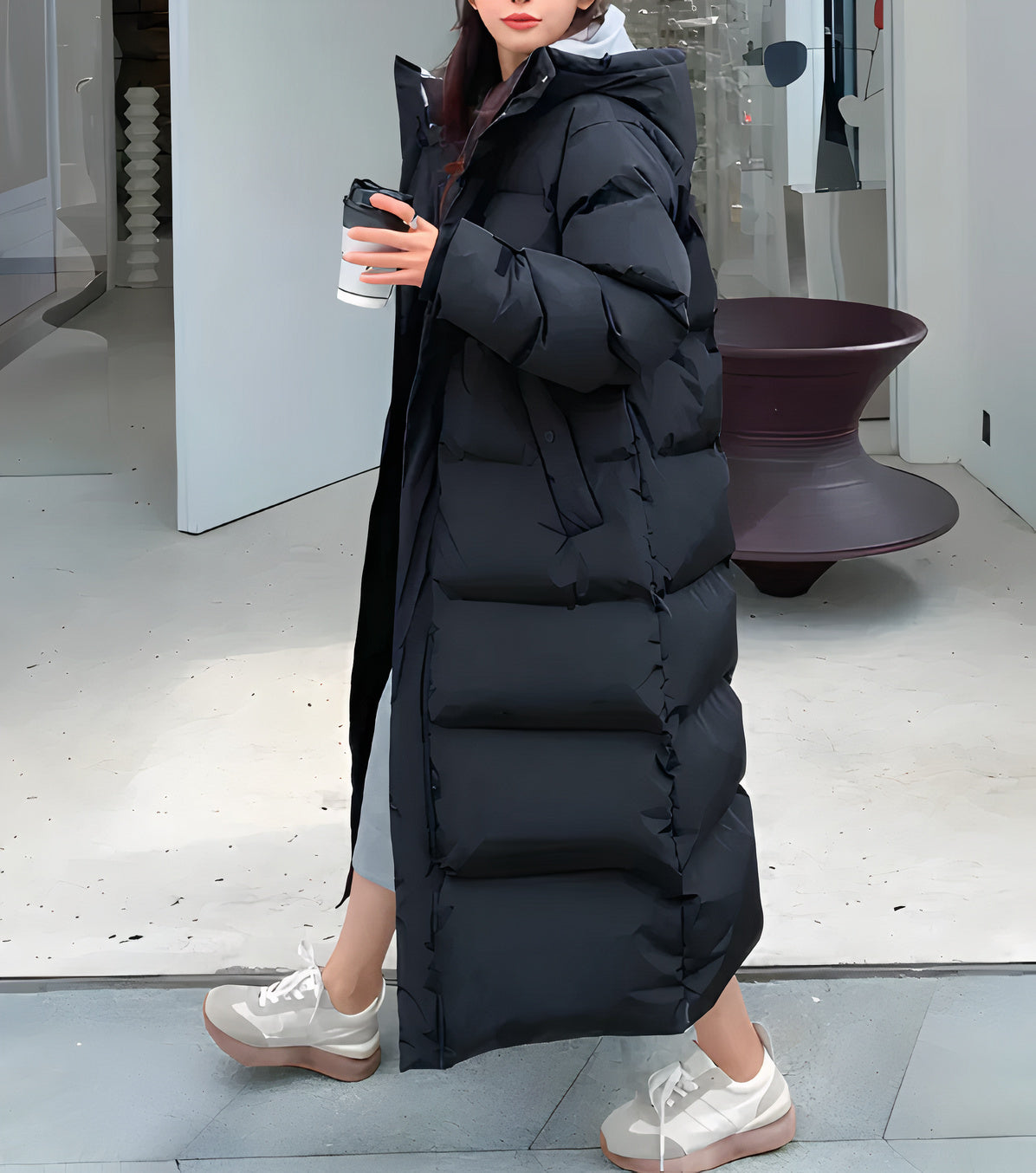 "Women's long puffer jacket, hooded winter coat, front view; insulated, water-resistant, sleek fit for warmth and style."