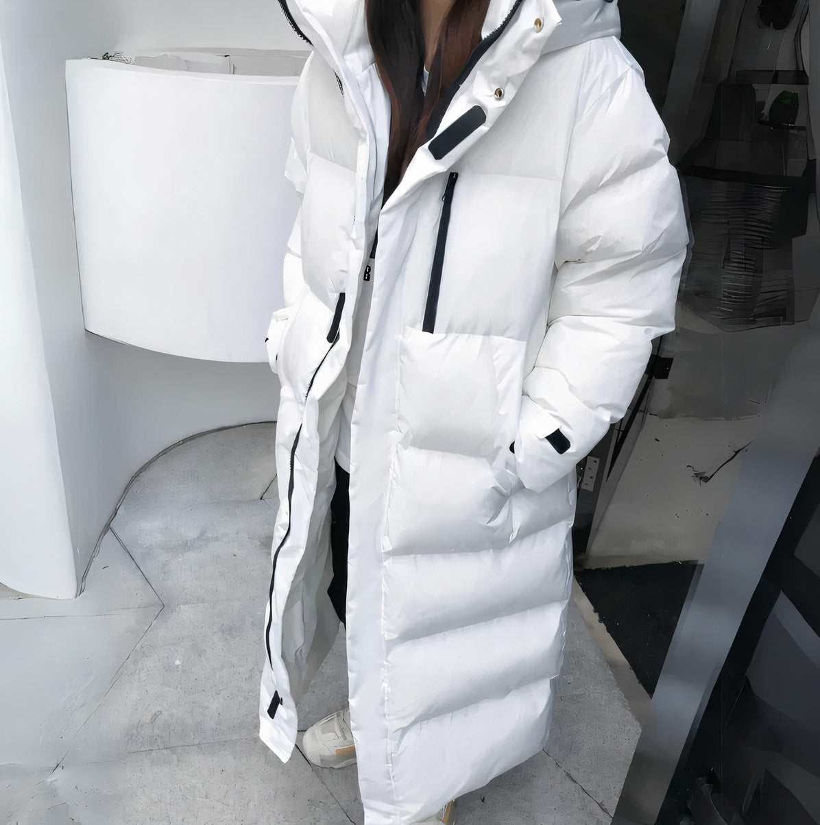 "Women's long puffer jacket, hooded winter coat, front view; insulated, water-resistant, sleek fit for warmth and style."