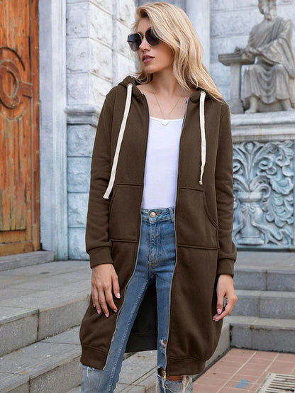 Women's longline zip hoodie with drawstring hood, midweight fabric, extended length, cozy style for cooler seasons.