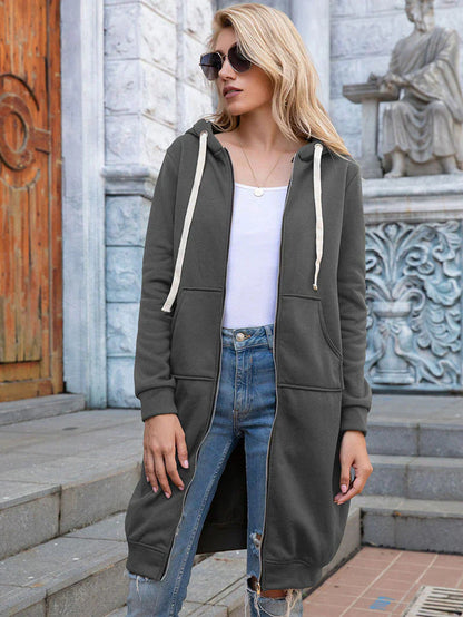 Women's longline zip hoodie with drawstring hood, midweight fabric, extended length, cozy style for cooler seasons.