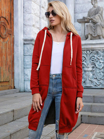 Women's longline zip hoodie with drawstring hood, midweight fabric, extended length, cozy style for cooler seasons.