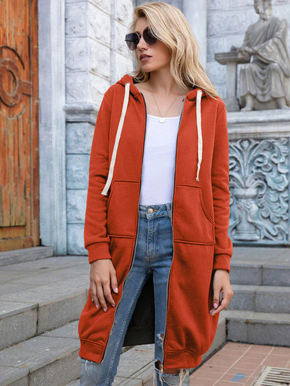 Women's longline zip hoodie with drawstring hood, midweight fabric, extended length, cozy style for cooler seasons.