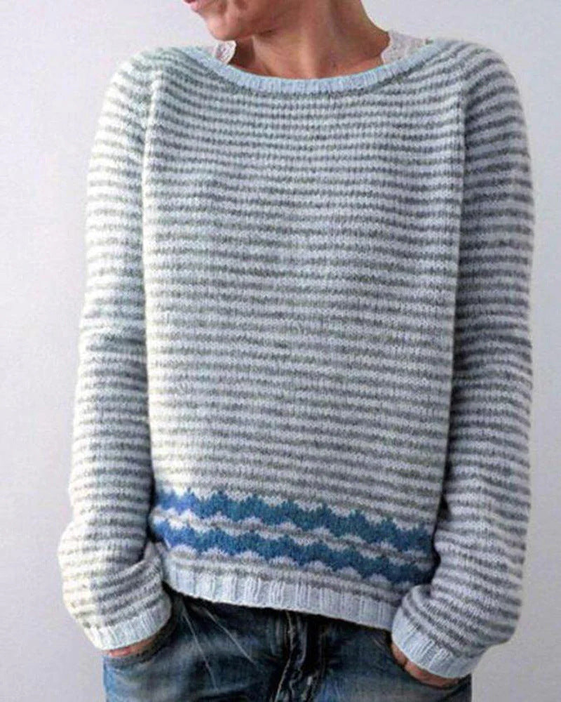 Women's multicolor knit patterned sweater with crew neck, showcasing bold colors and unique design, front view.