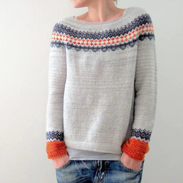 Women's multicolor knit patterned sweater with crew neck, showcasing bold colors and unique design, front view.