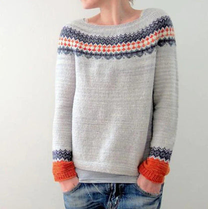 Women's multicolor knit patterned sweater with crew neck, showcasing bold colors and unique design, front view.