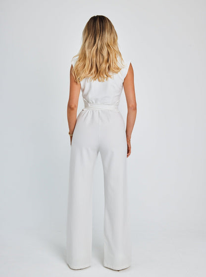 "Women's sleeveless belted jumpsuit with wide-leg, soft fabric, and detachable belt for stylish and comfortable wear."