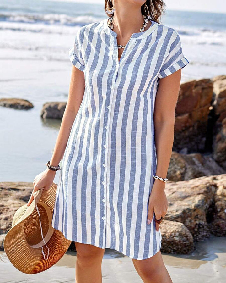 Women's striped V-neck shirt dress in cotton blend with a modern stand collar, front view highlighting tailored design.