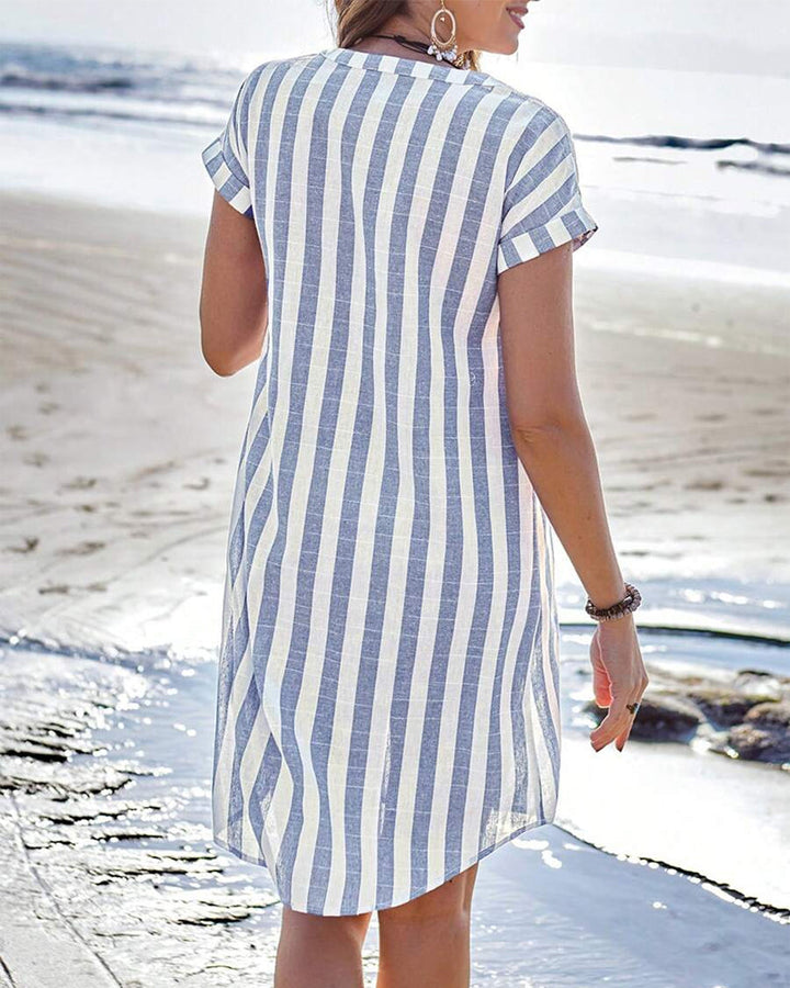 Women's striped V-neck shirt dress in cotton blend with a modern stand collar, front view highlighting tailored design.