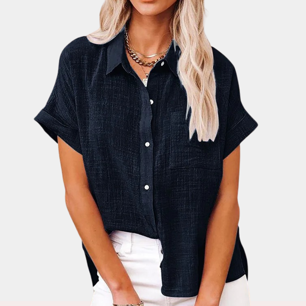 "Women's summer blouse with button-down front and classic collar, relaxed fit in light blue, front view."