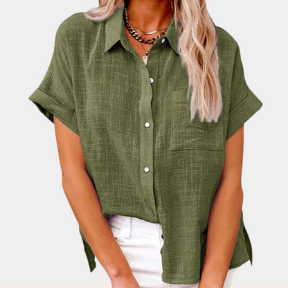 "Women's summer blouse with button-down front and classic collar, relaxed fit in light blue, front view."