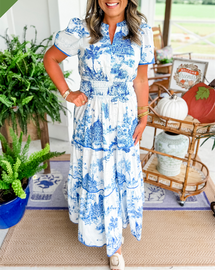 Women's toile print maxi dress with puff sleeves, showcases vintage charm with a scenic motif and fitted silhouette.